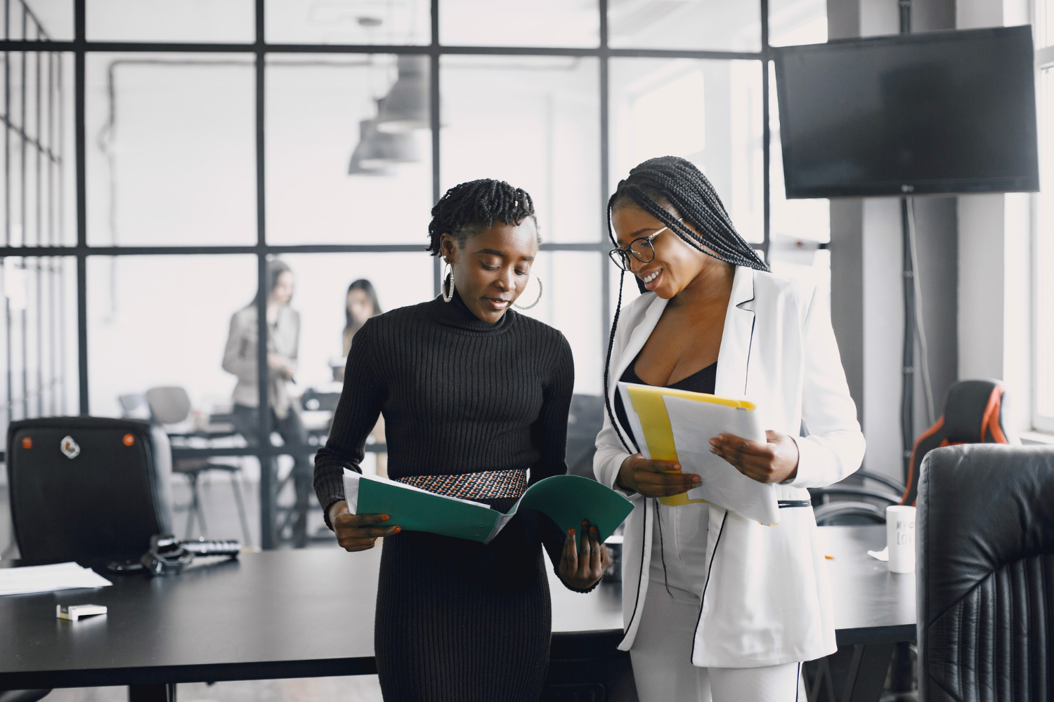Corporate professionals collaborating in a modern office